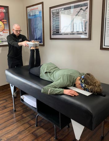 Chiropractor West Des Moines IA Branden Miller with Patient